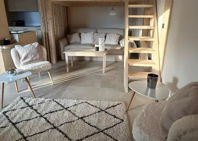 a living room with a couch and a table at Appartement Dolce Vista in Passy