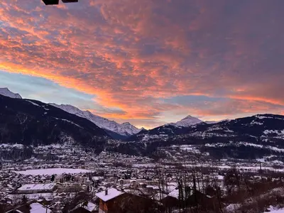 a view of a city with snow covered mountains at Appartement Dolce Vista in Passy