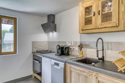 a kitchen with a sink and a stove top oven at Appartement Chez Albert situé 25KM Chamonix in Saint-Gervais-les-Bains