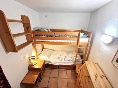 a small room with two bunk beds in it at La Ginabelle 2 - Vue MontBlanc in Chamonix-Mont-Blanc