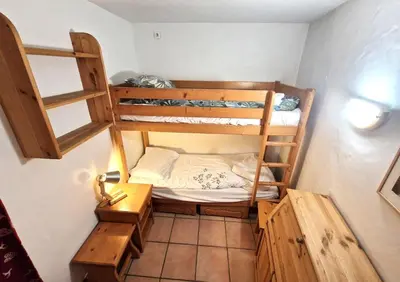 a small room with two bunk beds in it at La Ginabelle 2 - Vue MontBlanc in Chamonix-Mont-Blanc