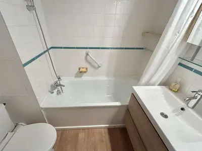 a bathroom with a white tub and a toilet at Studio à Megève avec parking souterrain et casier à skis - FR-1-597-189 in Megève