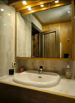a bathroom with a sink and a mirror at Apartment in residence near the Mont d'Arbois in Megève
