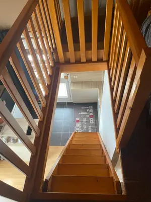 an overhead view of a wooden staircase in a house at Les blanches aiguilles in Les Carroz d'Araches
