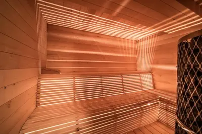 a wooden sauna with a window in the middle at Chalet Betula, Saint-Gervais - by EMERALD STAY in Saint-Gervais-les-Bains