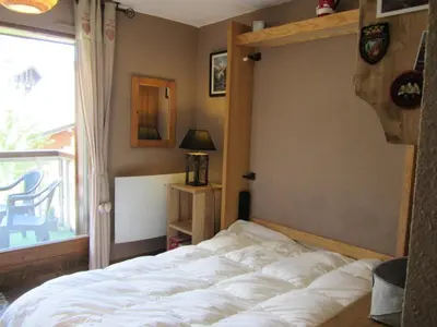 a bedroom with a bed in a room with a window at Résidence Combettes - Combettes E288 MAE-5071 in Les Contamines-Montjoie