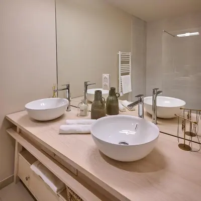 a bathroom with two sinks and a large mirror at Le Miroir De Saint-Jacques in Sallanches