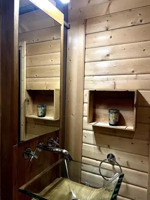 a bathroom with a sink and a mirror at Chalet Nuances certifié 5 étoiles in Les Contamines-Montjoie
