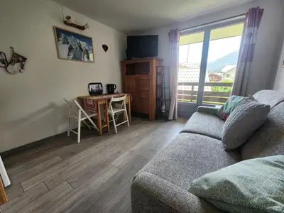 a yard covered in snow with houses and trees at Studio 19m² à Samoëns, 4 pers, animaux admis, parking - FR-1-629-144 in Samoëns
