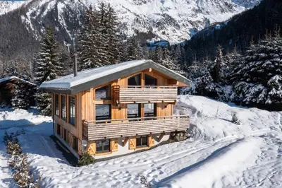 a log cabin in the snow in the mountains at Chalet Les Grands Montets in Chamonix-Mont-Blanc