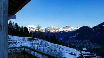 a view of a snowy mountain range with snow covered mountains at Appartement Proche Des Pistes By TerraAlpina in Saint-Gervais-les-Bains