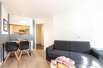 a living room with a couch and a table at Au Coin du Mont Blanc in Chamonix-Mont-Blanc