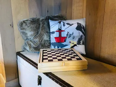a chess board sitting on top of a box at Cosy duplex with Hammam-Steamroom in Rochebrune in Megève