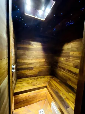 an empty sauna in a room with a ceiling at Cosy duplex with Hammam-Steamroom in Rochebrune in Megève