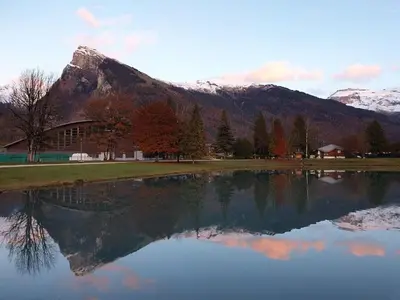 a reflection of a mountain in a body of water at Petit Brio - Fabulous apartment in Samoens sleeps up to 4 in Samoëns