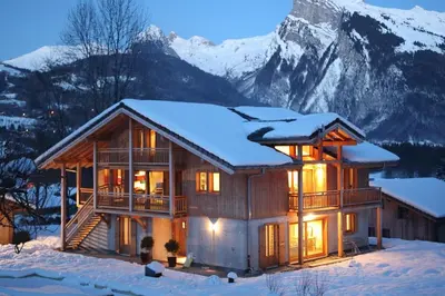 a house in the snow with a mountain at Petit Brio - Fabulous apartment in Samoens sleeps up to 4 in Samoëns