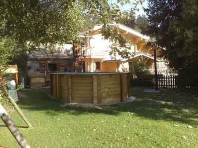 a wooden building in the yard of a house at Chalet vue montagne , proche des pistes in Megève
