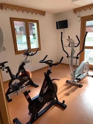 a room with several exercise bikes in it at Studio Résidence grand tetras in Samoëns