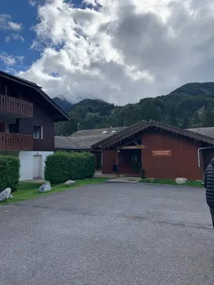a couple of buildings with mountains in the background at Studio Résidence grand tetras in Samoëns