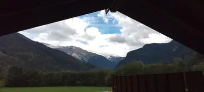 a view of a valley with mountains in the distance at Studio Résidence grand tetras in Samoëns