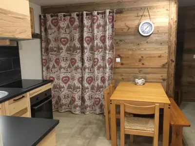 a bathroom with a sink and a mirror and a tub at Appartement de charme familial aux CARROZ d ARACHES in Arâches-la-Frasse