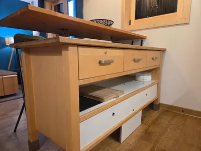 a wooden cabinet with two drawers in a room at La Cabane Charmant T2 avec jardin centre village in Saint-Gervais-les-Bains