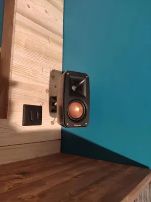 a speaker on a wall next to a wall at La Cabane Charmant T2 avec jardin centre village in Saint-Gervais-les-Bains