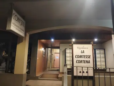 a building with a sign that reads valhalla la commerce center at La Cabane Charmant T2 avec jardin centre village in Saint-Gervais-les-Bains