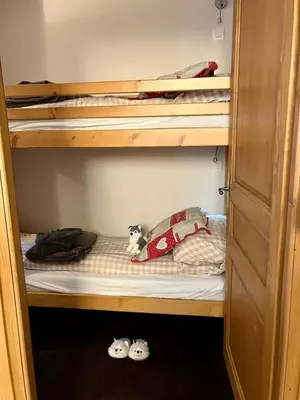 two stuffed animals are sitting on a bunk bed at Cozy comfort, pool and spa close to Mont Blanc in Vallorcine