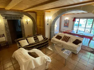 a living room with two couches and a table at Appartement au cœur de Samoëns – 3 chambres, 2 sdb, parking inclus - FR-1-629-143 in Samoëns