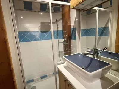 a bathroom with a sink and a shower at Appartement au cœur de Samoëns – 3 chambres, 2 sdb, parking inclus - FR-1-629-143 in Samoëns