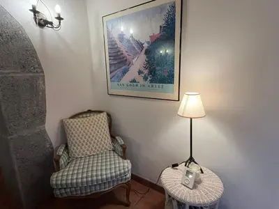 a chair and a lamp in a corner of a room at Appartement au cœur de Samoëns – 3 chambres, 2 sdb, parking inclus - FR-1-629-143 in Samoëns