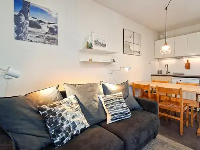 a living room with a couch and a table at Appartement spacieux 6 pers, balcon, Flaine centre - FR-1-425-229 in Arâches-la-Frasse