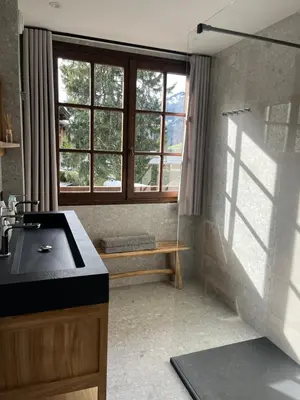 a bathroom with a sink and a window at Confort et Proximité in Megève