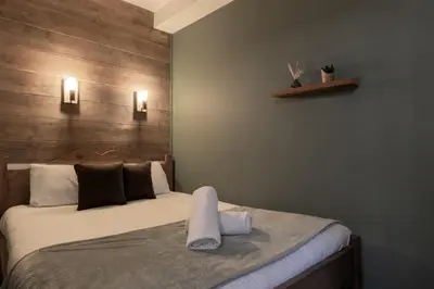 a bedroom with a bed with two towels on it at Jonquille 2 - Centre - Terrasse Privee - Vues in Chamonix-Mont-Blanc