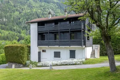 a house with a black and white at Cozy big Chalet with Spectacular Mont-Blanc View in Chamonix-Mont-Blanc
