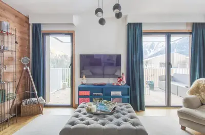 a living room with a couch and a table at Apartment Aiguille Rose in Les Houches