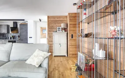 a living room with a couch and a kitchen at Apartment Aiguille Rose in Les Houches