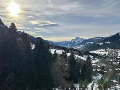 a view of a snowy mountain with the sun in the sky at Appartement 2 Pièces + Coin Nuit, 4-6 Couchages avec Balcon et Parking à Megève - FR-1-597-191 in Megève