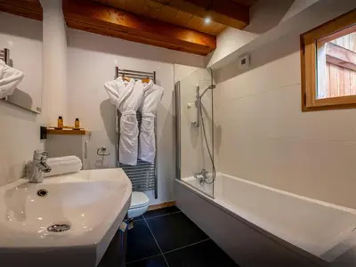 a bathroom with a sink and a shower and a toilet at Chalet OCimes - OVO Network in Samoëns