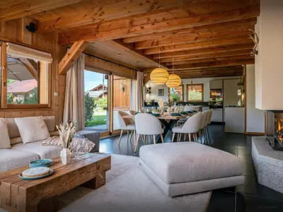 a living room with a couch and a table at Chalet OCimes - OVO Network in Samoëns