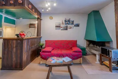 a kitchen with a counter and a sink in a room at Résidence Améthystes B02 ski in ski out - Happy Rentals in Chamonix-Mont-Blanc