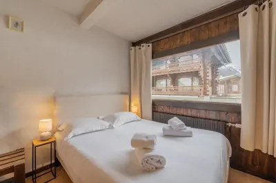 a living room with two bunk beds and a couch at Résidence Améthystes B02 ski in ski out - Happy Rentals in Chamonix-Mont-Blanc