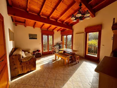 a living room with a couch and a table at Appartement Saint-Gervais in Saint-Gervais-les-Bains