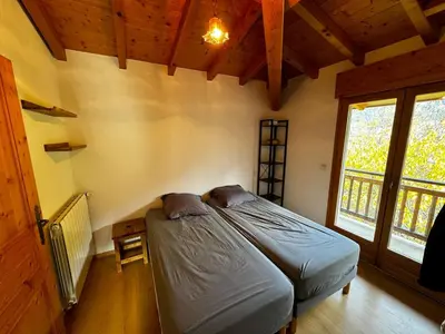 a bedroom with a bed in a room with a window at Appartement Saint-Gervais in Saint-Gervais-les-Bains