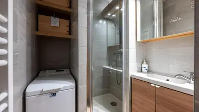a bathroom with a shower and a toilet and a sink at Les Eterlous N35 - 2P4 in Morillon