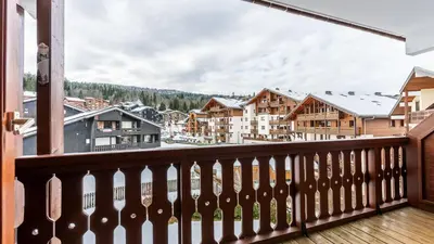 a balcony with a view of a town at Les Eterlous N35 - 2P4 in Morillon