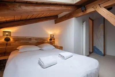a kitchen and living room with a table and chairs at Duplex T3 with terrace in Chamonix in Chamonix-Mont-Blanc
