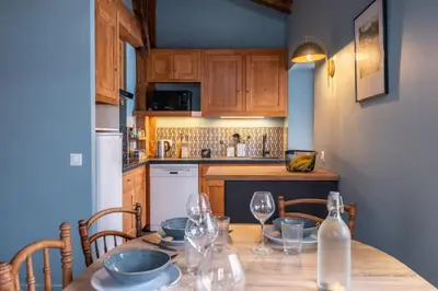 a bedroom with two beds and a desk in a room at Duplex T3 with terrace in Chamonix in Chamonix-Mont-Blanc