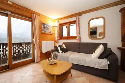 a living room with a couch and a table at Résidence Les Hauts De Chavants - Hauts de chavants Albert 1er n°3 MAE-2651 in Les Houches